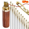 A set of 12 gold and silver self-threading sewing needles stored in a wooden container.