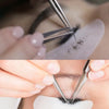 Hands using precision stainless steel tweezers to apply or manipulate eyelash extensions.