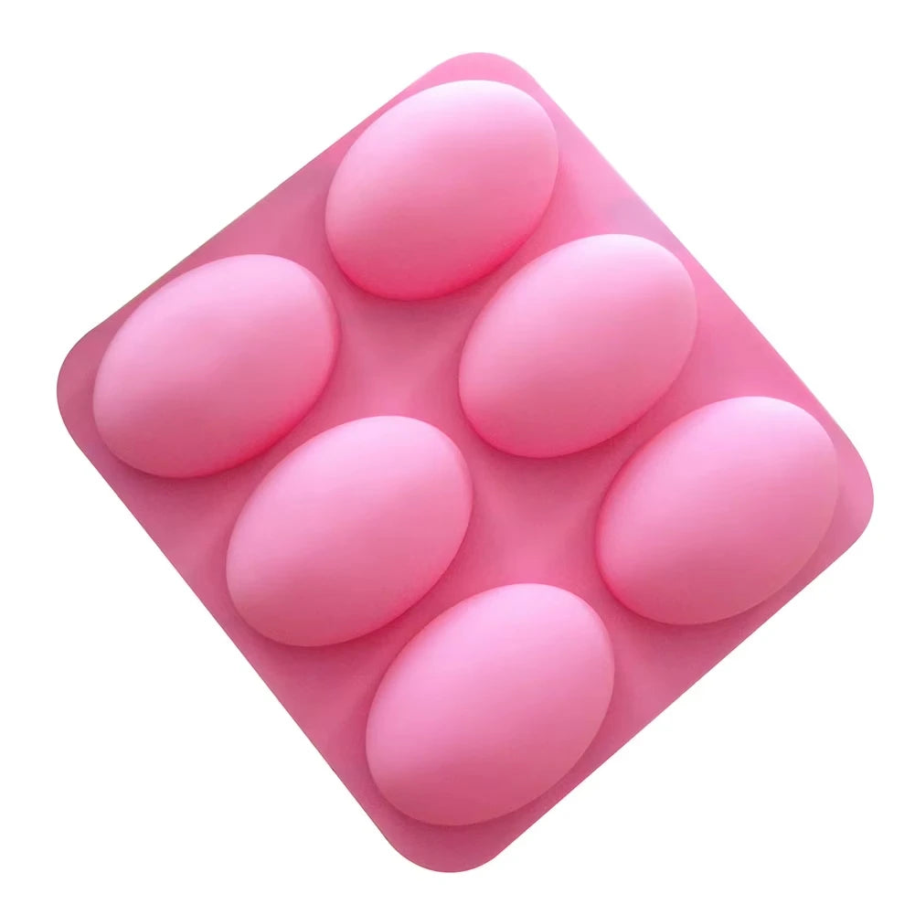 A pink silicone mold with six cavities for soap, baking, and DIY crafts.