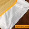 White plastic sheeting pre-taped for easy positioning on a wooden surface.