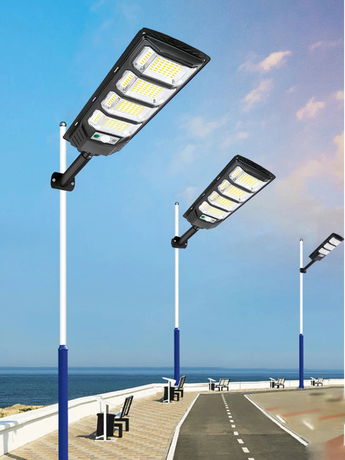 A modern solar street light fixture mounted on a pole, illuminating a paved walkway.