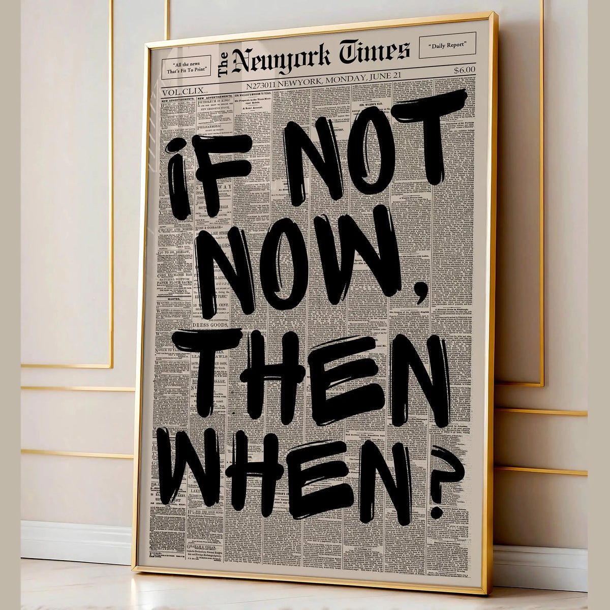 Framed canvas wall art featuring a black and white newspaper-style quote on a light background.