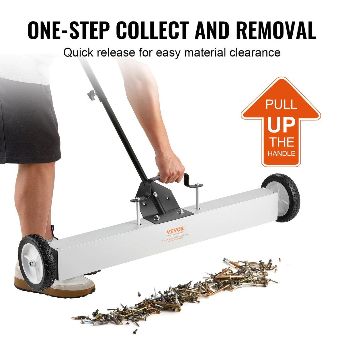 A white rolling magnetic sweeper with a long handle is shown being used to collect debris.
