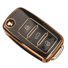 A black TPU silicone car key case with a gold-colored finish, showing multiple key cutouts.
