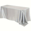 A smooth, silver-grey satin tablecloth draped elegantly on a table.