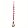 A pink silicone pacifier clip with a teether attached.