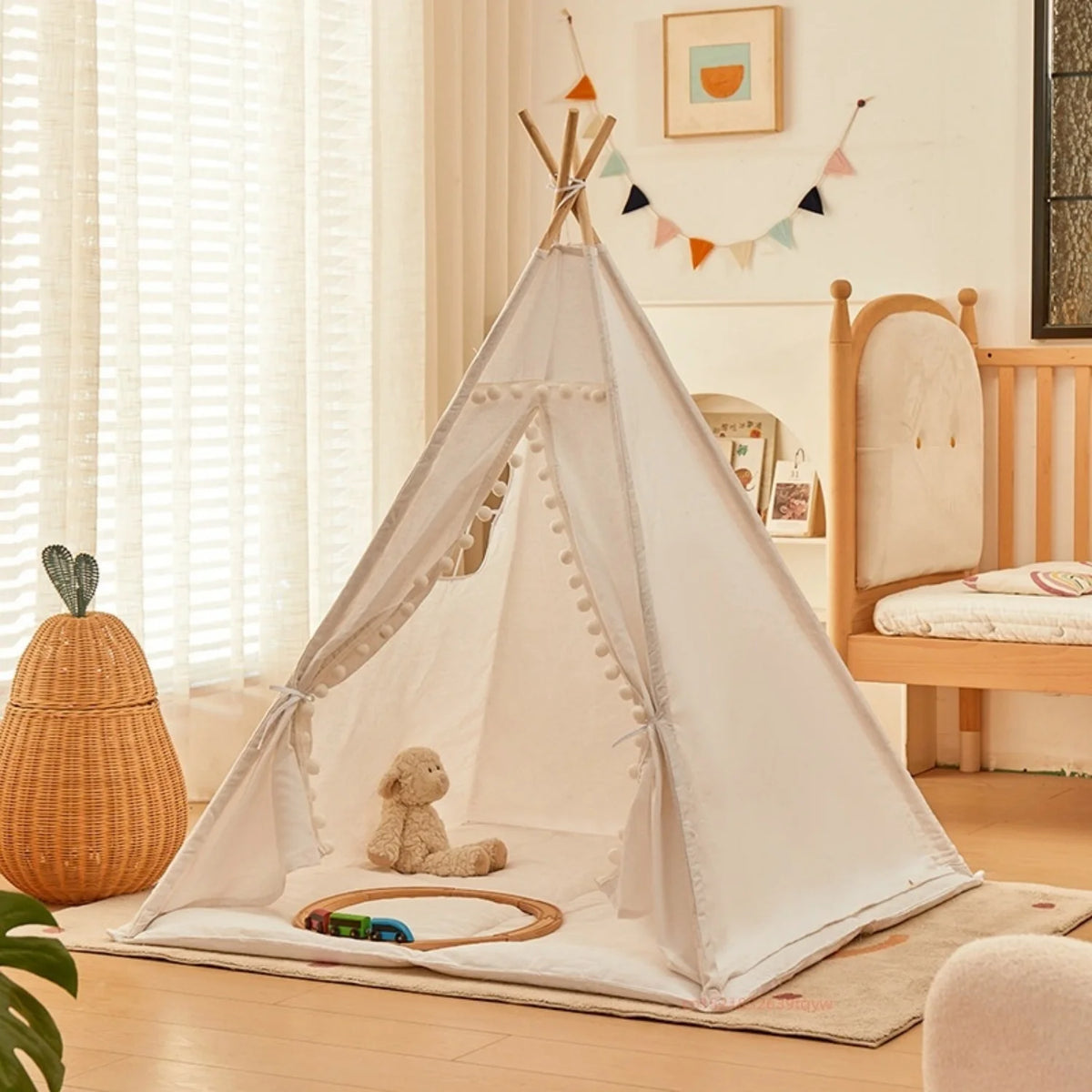 A white foldable play tent with curtains is set up indoors on a wooden floor, featuring a stuffed animal inside.