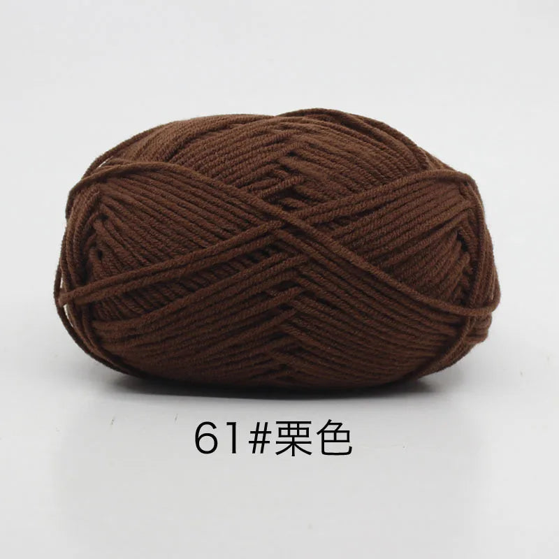 A ball of dark brown, 4-ply milk cotton yarn for knitting and crochet.