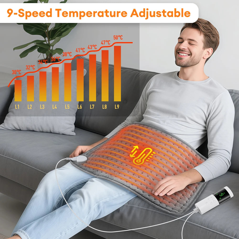 A man is using a 9-speed temperature adjustable electric heating pad on his lap while sitting on a sofa.