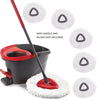 A set of white triangular microfiber replacement mop pads for spin mops shown with a red handle and a black bucket.
