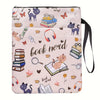 A pink fabric book sleeve with a zipper featuring a design of cats and books.