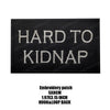 Black embroidered patch with the text HARD TO KIDNAP in white thread
