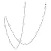 A delicate silver chain featuring a star and moon pendant design.