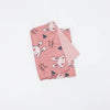 Pink soft cotton baby pillowcase featuring a repeating cartoon rabbit design