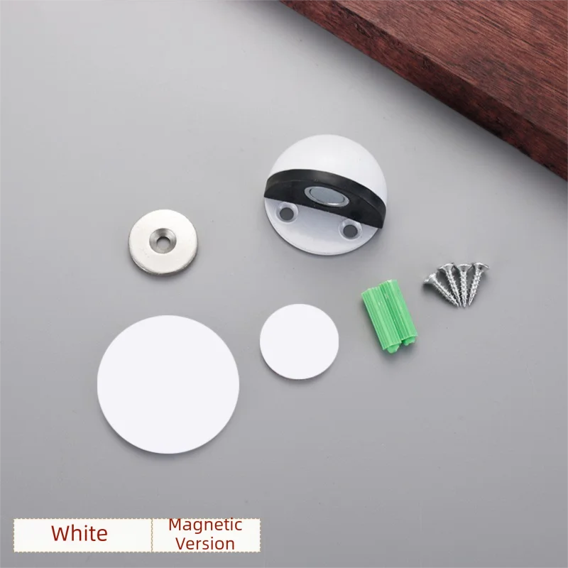 White magnetic door stopper set including a round plate, a circular disc, and a green plastic piece.