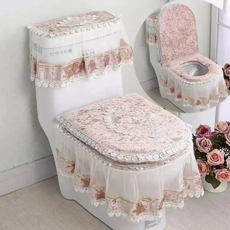 A white toilet seat cover set with a washable cushion featuring lace trim and floral embroidery.
