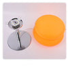 Modern cloud-shaped bedside lamp featuring an orange light and a silver base.