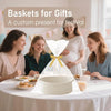 A white handwoven rope storage basket is displayed on a table setting for gifts.