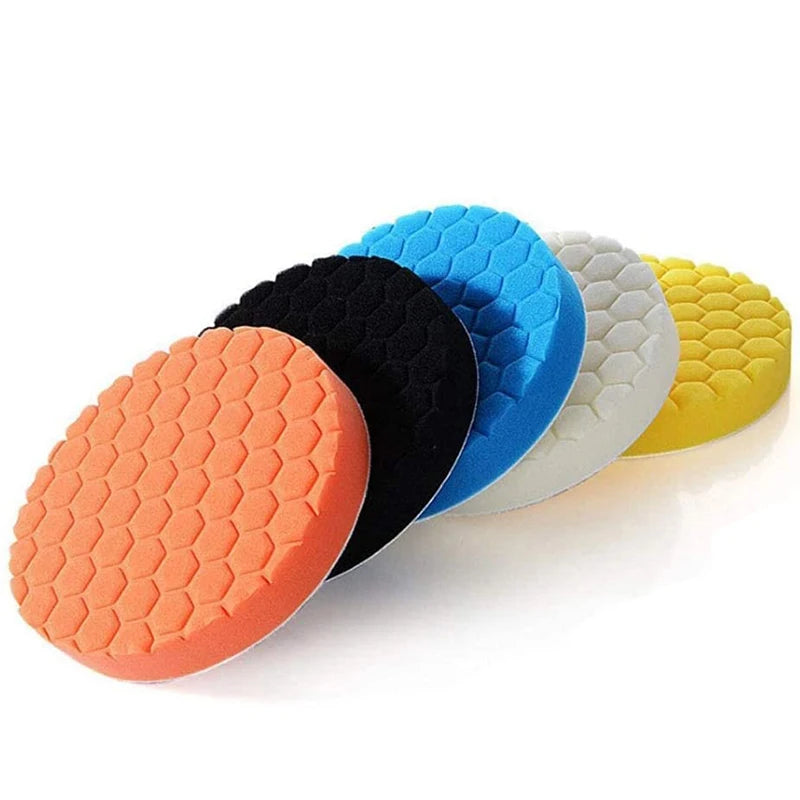 A set of five colored car polishing sponge pads with hook-and-loop backing arranged in a row.