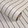 Roll of 3D grille pattern peel-and-stick wallpaper with thin black stripes