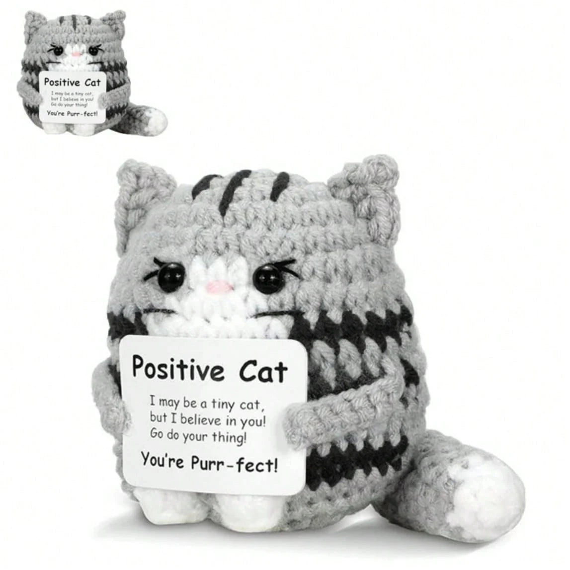 A gray and black knitted cat plush ornament with a tag that reads Positive Cat