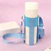 A light blue breathable mesh crossbody water bottle carrier with a white bottle and matching strap on a pink background.
