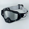 Black motorcycle goggles with a gray strap are shown against a white background.