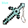 A glow-in-the-dark transformable gemstone toy keychain with a black and light blue geometric design.