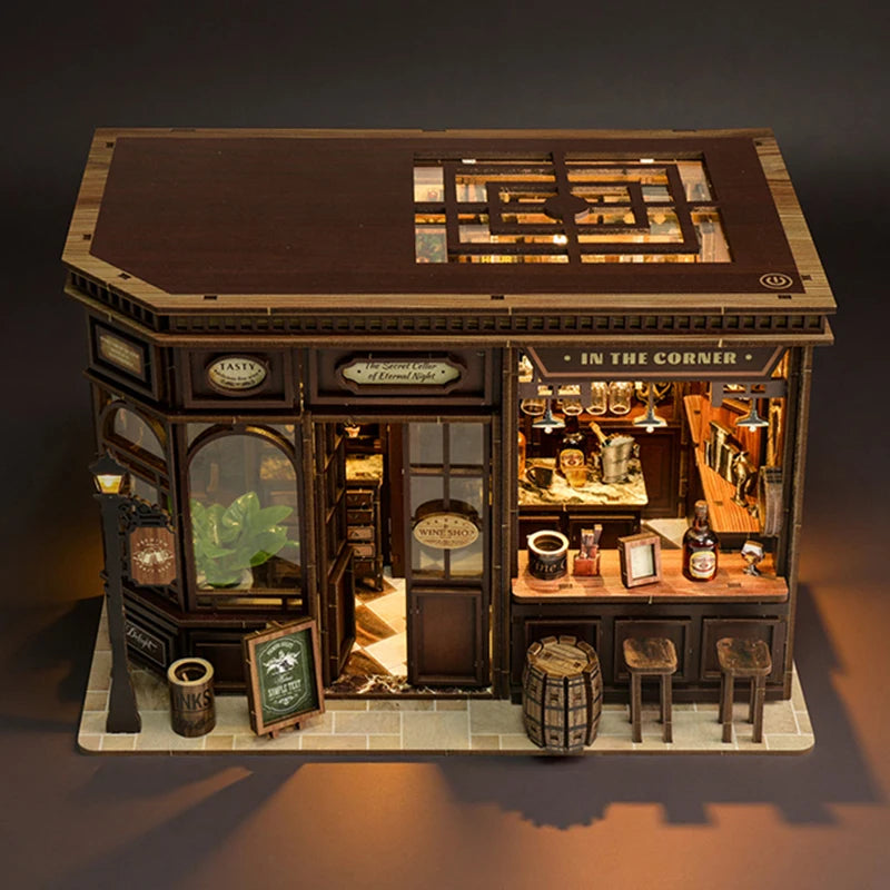 A detailed wooden dollhouse miniature assembly kit featuring a facade with glass windows and interior details.