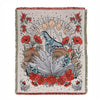 A woven throw blanket featuring a floral and celestial design in muted earth tones and red accents.