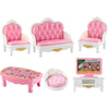A set of pink quilted miniature dollhouse furniture including a bed, sofa, and chair for a bedroom or living room.