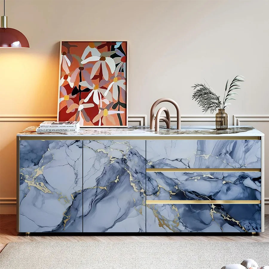 A kitchen backsplash featuring blue marble with gold veining and horizontal stripes.