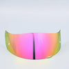 A motorcycle helmet visor lens shield with a gradient pink and green tint.
