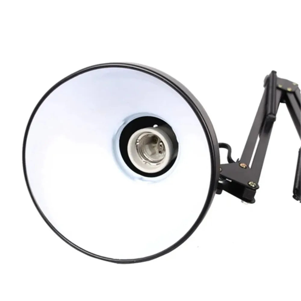 Adjustable swing arm desk lamp with clamp mount featuring a round, bright light head.