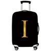 Black luggage with a gold letter I print and silver handles