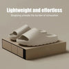 A pair of beige cloud thick-soled EVA slides resting on a wooden block.