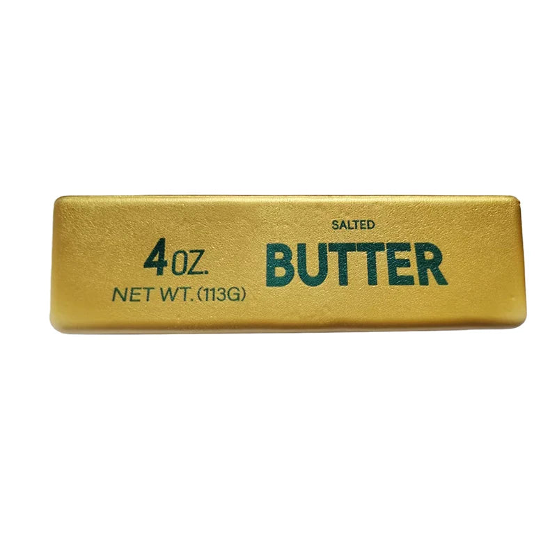 A rectangular gold-colored butter fidget stick labeled 4oz salted butter net wt 113g