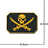 A black embroidered patch featuring a yellow skull and crossed swords design.