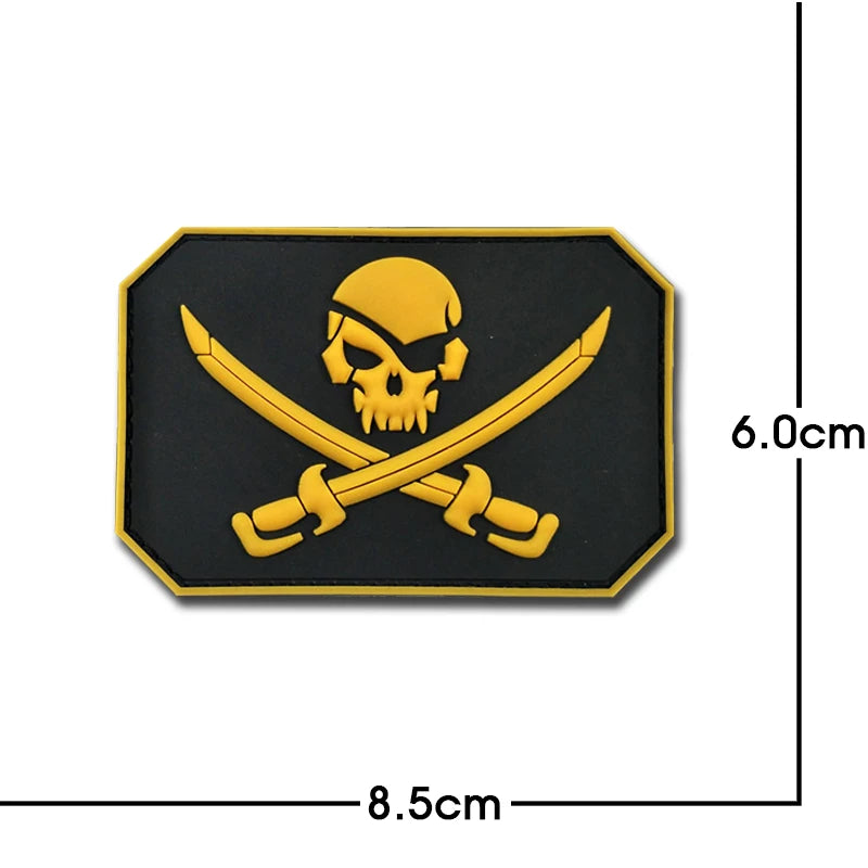 A black embroidered patch featuring a yellow skull and crossed swords design.