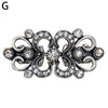 Silver vintage swirl clip featuring small clear stones used to fasten sweaters and shawls