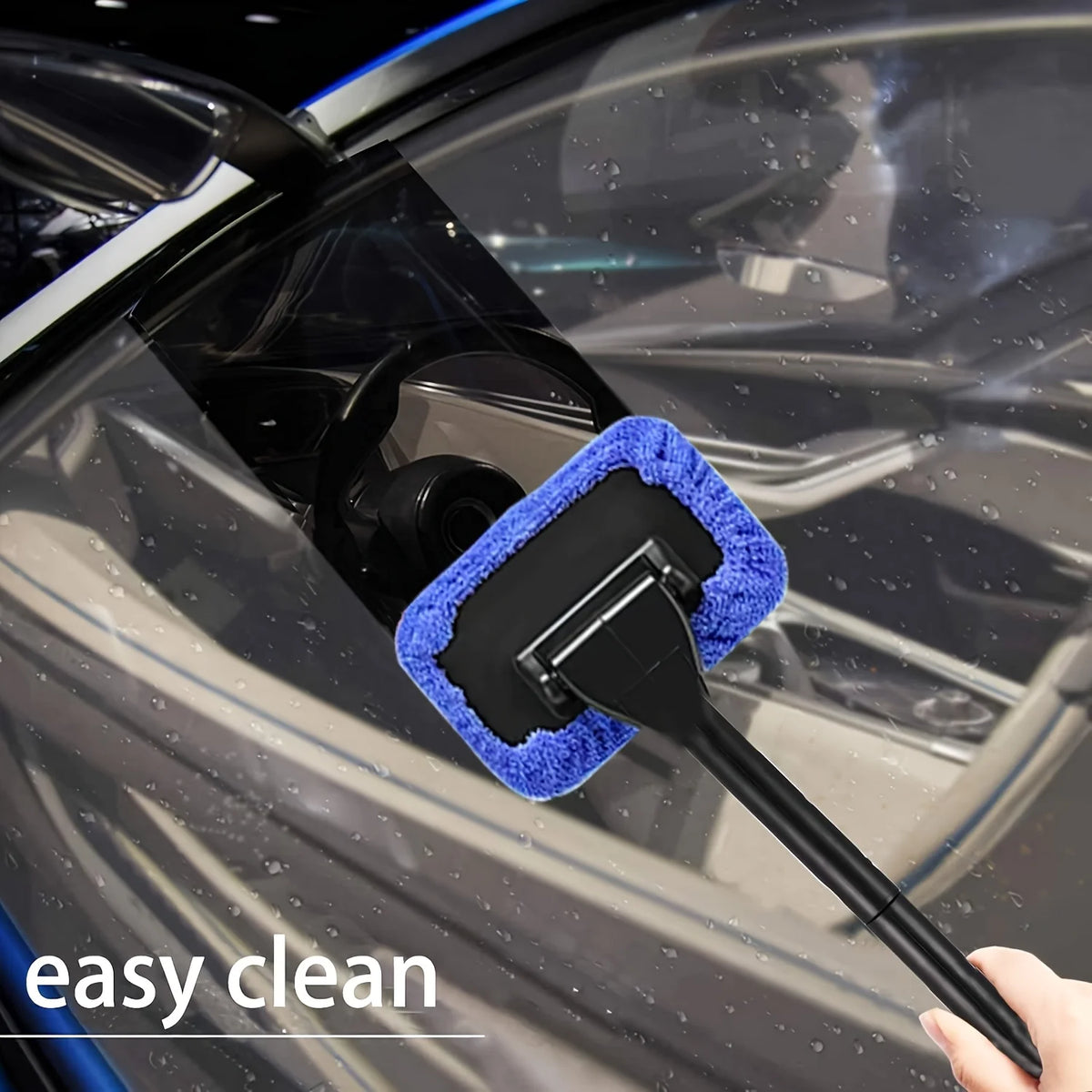 A black car windshield is being cleaned with a blue microfiber squeegee wiper tool.