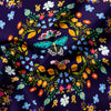 Purple fabric featuring a vibrant floral and butterfly print with yellow, orange, blue, and green accents.