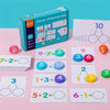 A box of digital operation cards and various arithmetic block cards for learning addition and subtraction.