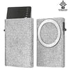 A slim aluminum pop-up card wallet with a textured surface shown in a vertical orientation.