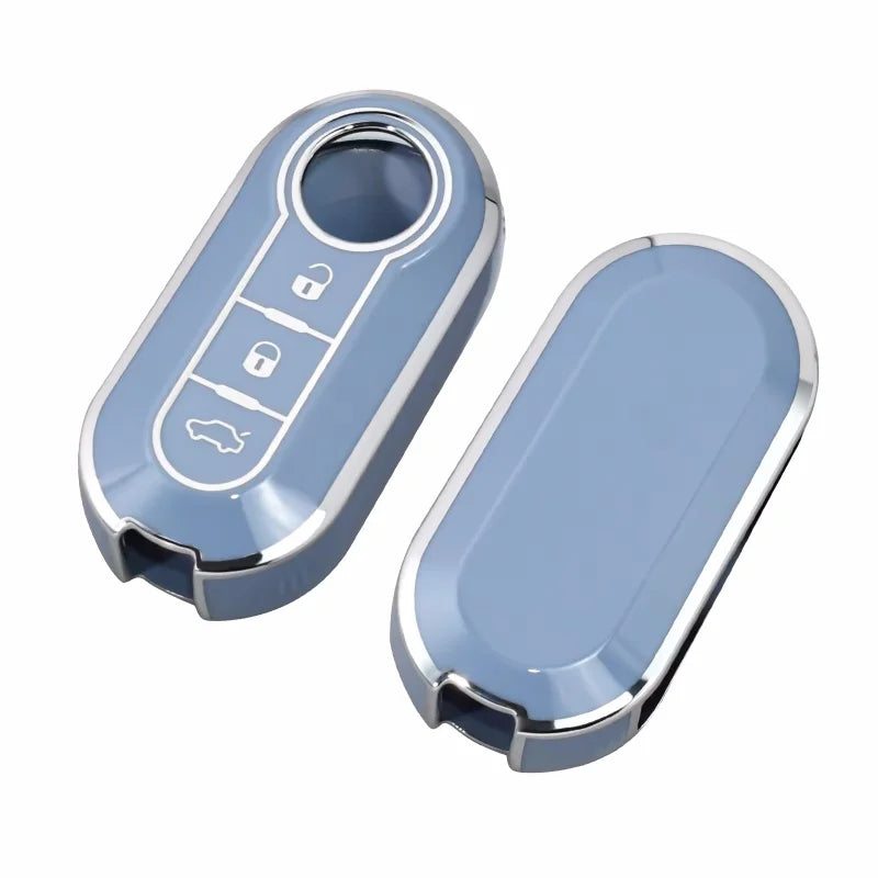 A light blue luxury leather key case with a slot and multiple key cutouts for Fiat and Citroen models.