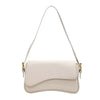A light beige vintage leather crossbody bag with a flap closure and thin strap.