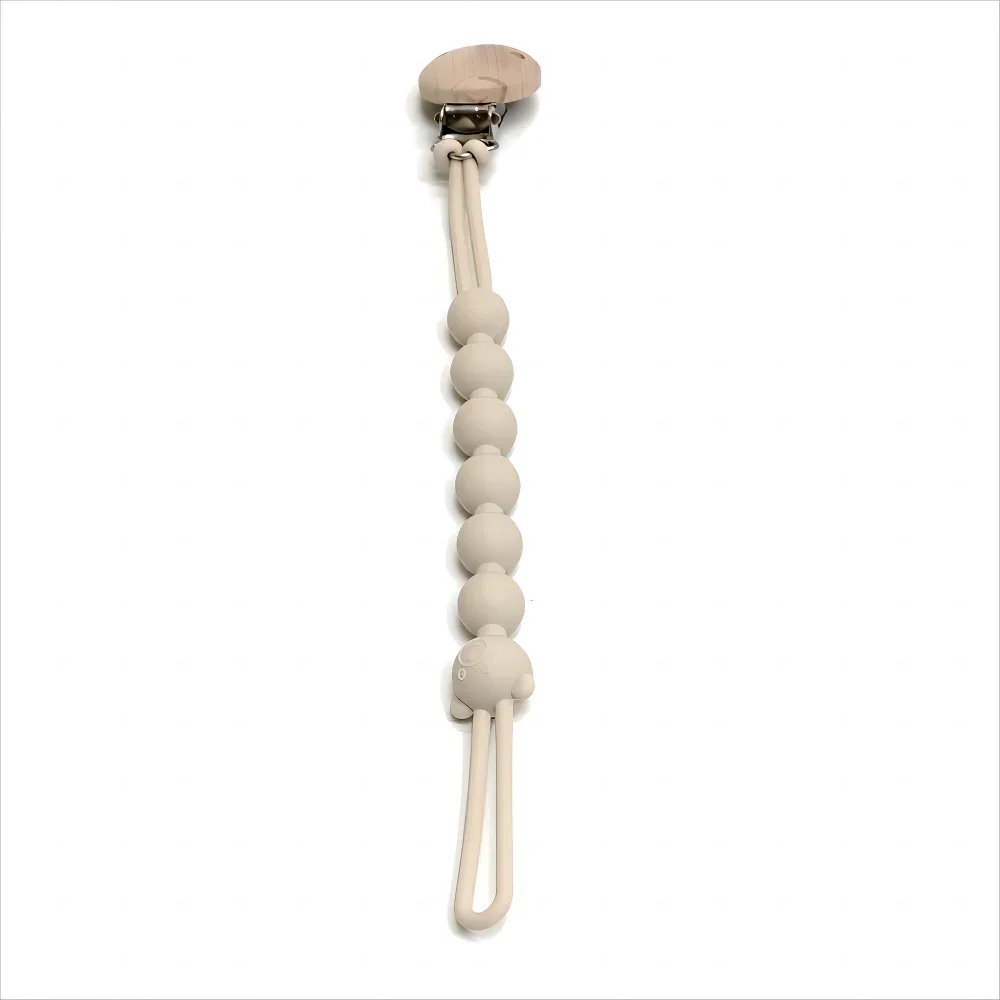 A light beige silicone pacifier clip with an anti-lost chain attached.