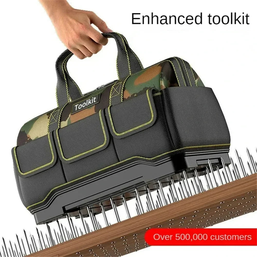 A hand holds a heavy-duty camouflage tool kit bag with a reinforced base, featuring olive green and black colors.