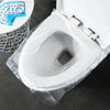 A white toilet seat is covered with a clear plastic disposable cover, showing a pack of blue instruction cards nearby.