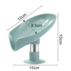 A light blue leaf-shaped suction cup soap dish with a self-draining tray and a silver base.